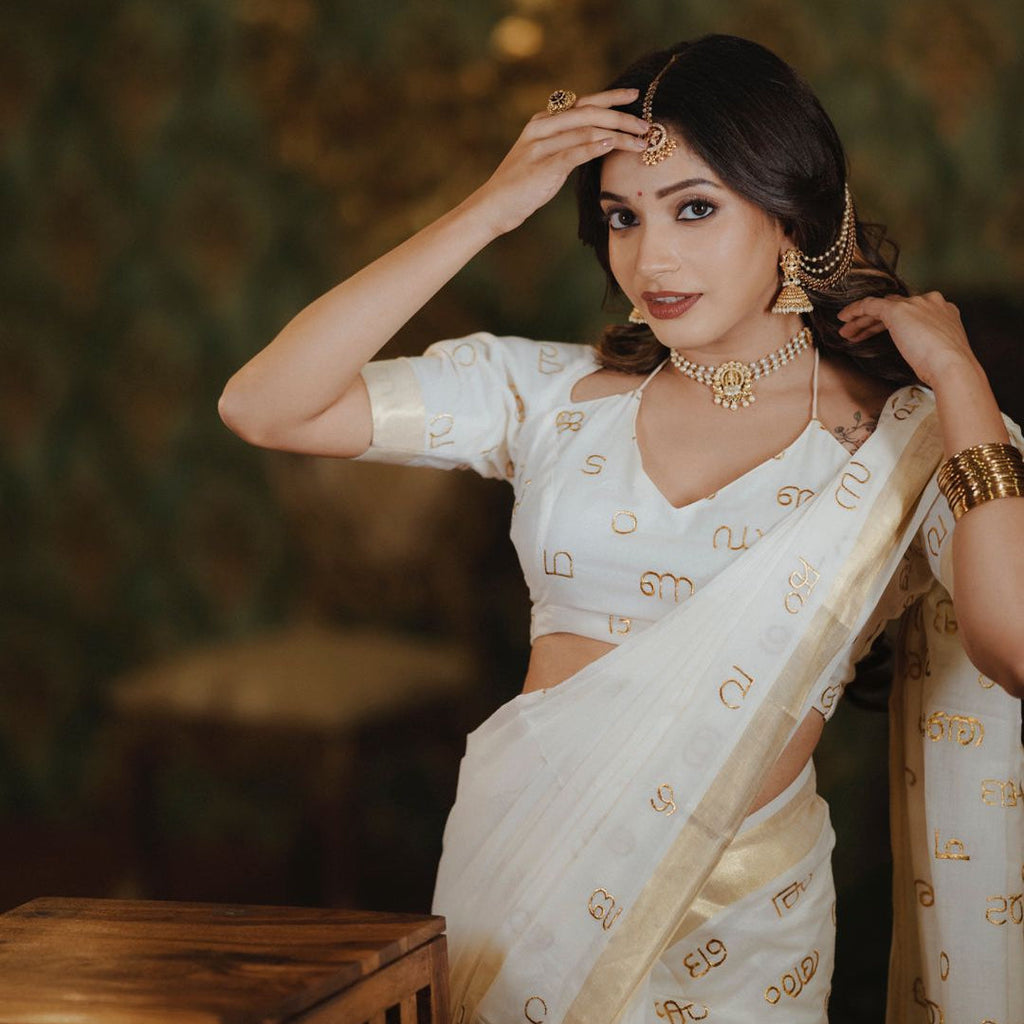 Malayalam Akshara Mala Embroidered Premium Cotton Saree – White with Golden Border