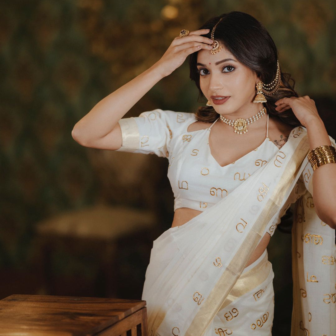 Malayalam Akshara Mala Embroidered Premium Cotton Saree – White with Golden Border